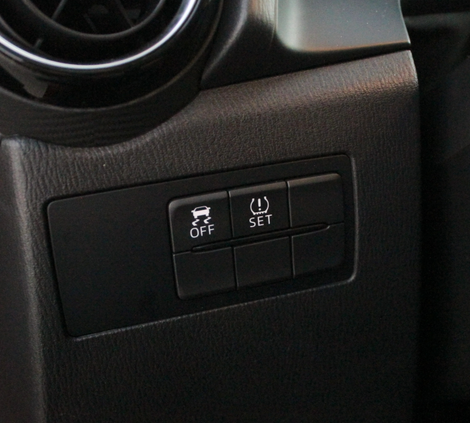 There’s a lot of blocked-off buttons on this car, but they do include the one button that matters: traction control off.